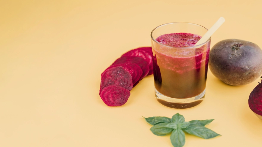 Carrots and beetroot with juice in glass