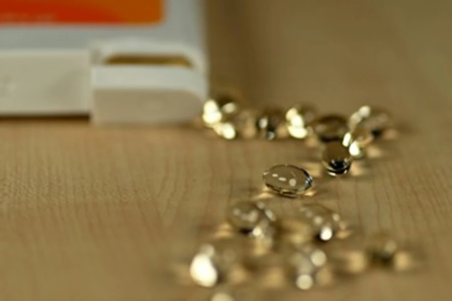 Multivitamin tablets and capsules arranged on a table for daily nutritional support